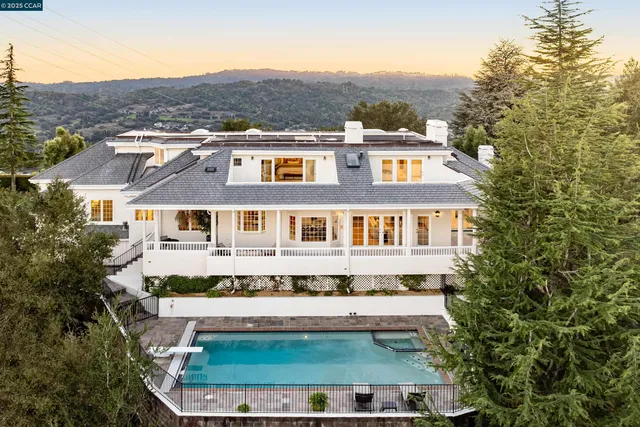 a front view of residential houses with yard