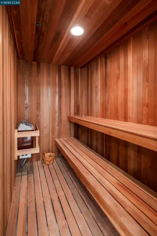a view of a balcony with wooden floor and furniture