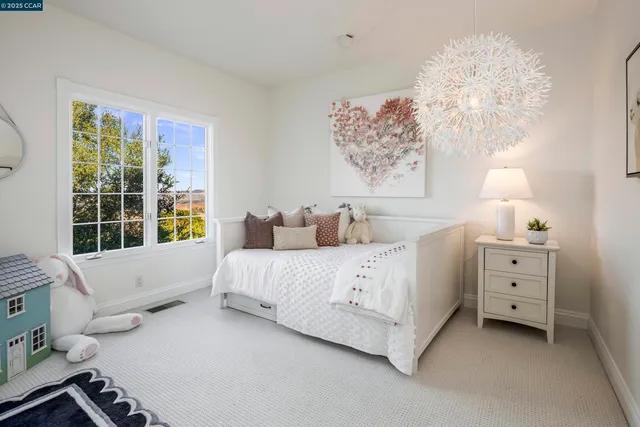 a bed room with a bed and a window