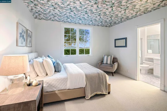 a bedroom with bed and a window