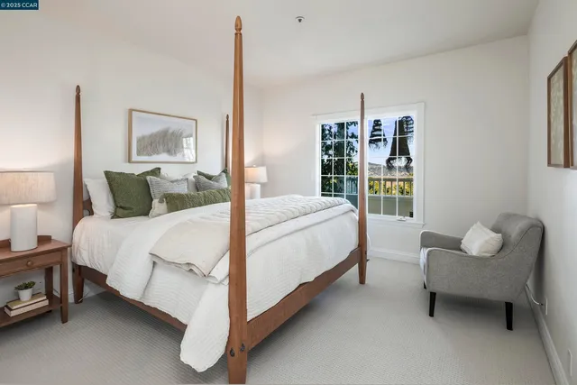 a bedroom with a bed and a couch