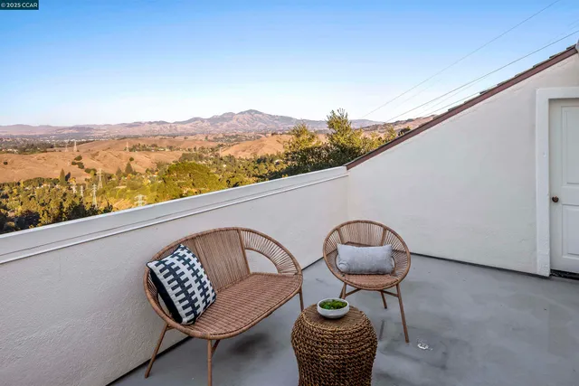 a view of roof deck with furniture