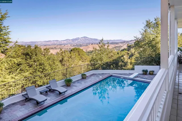 a view of a balcony with mountain view