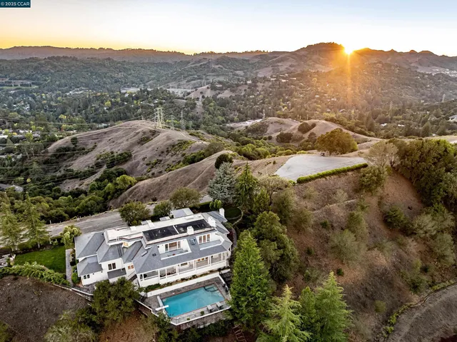 an aerial view of houses with yard