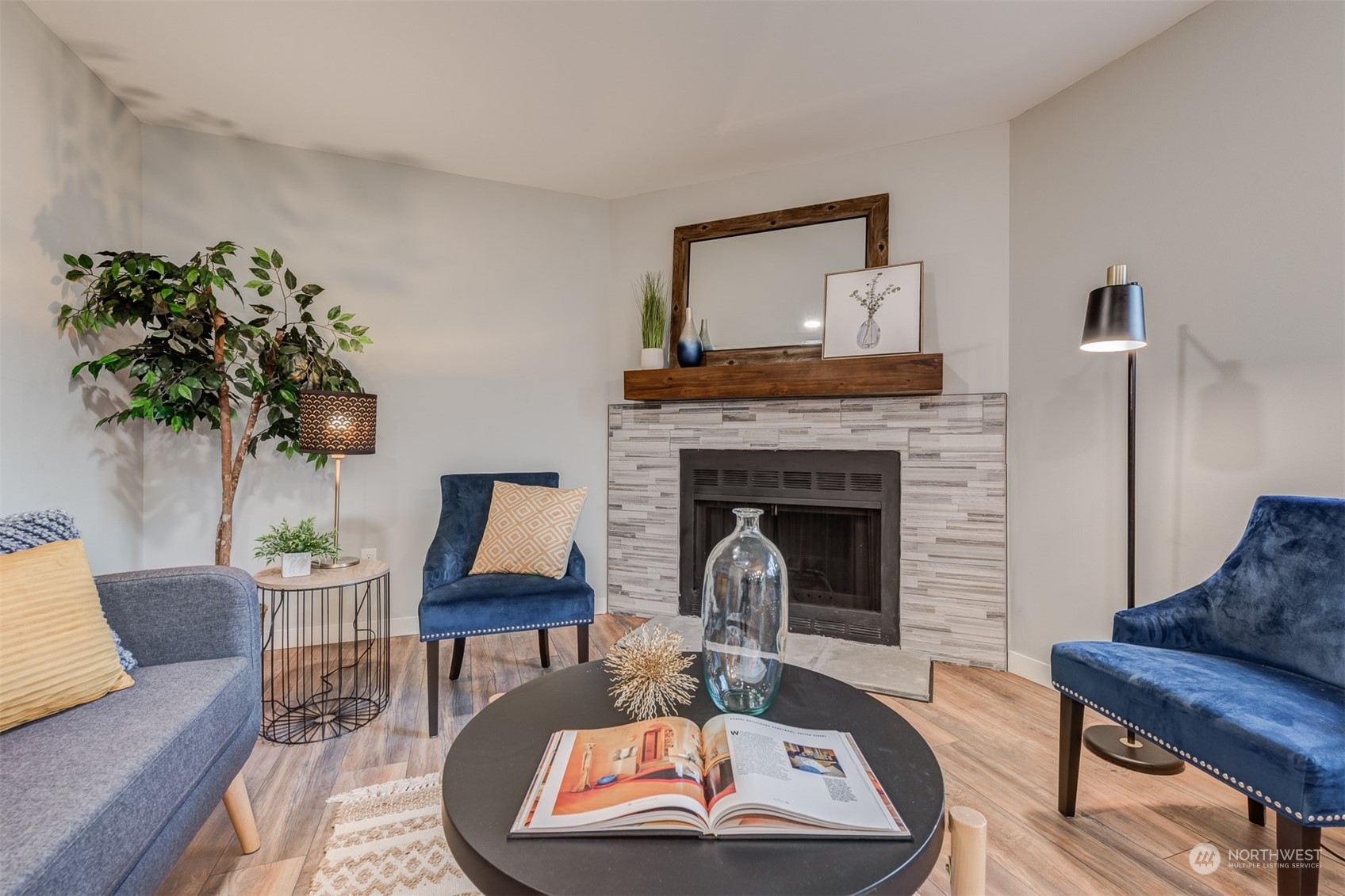 22319 18th Avenue Southeast Bothell, WA 98021 - Photo 15 of 34 a living room with furniture and a fireplace
