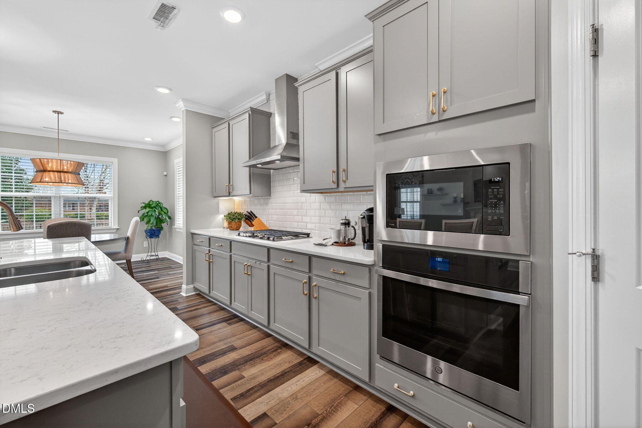 118 Mahogany Raleigh, NC 27610 - Photo 13 of 74 a kitchen with granite countertop white cabinets and white appliances
