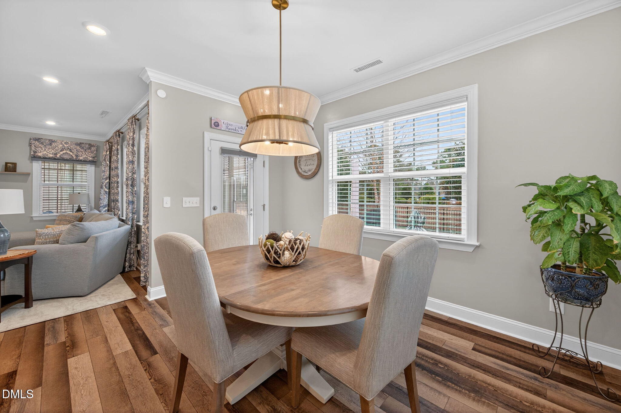 118 Mahogany Raleigh, NC 27610 - Photo 16 of 74 a view of a dining room with furniture window and wooden floor