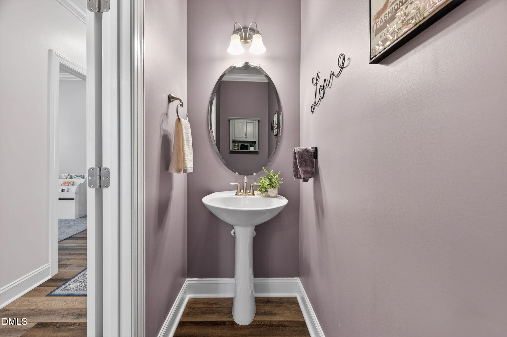 118 Mahogany Raleigh, NC 27610 - Photo 20 of 74 a bathroom with a sink and a mirror