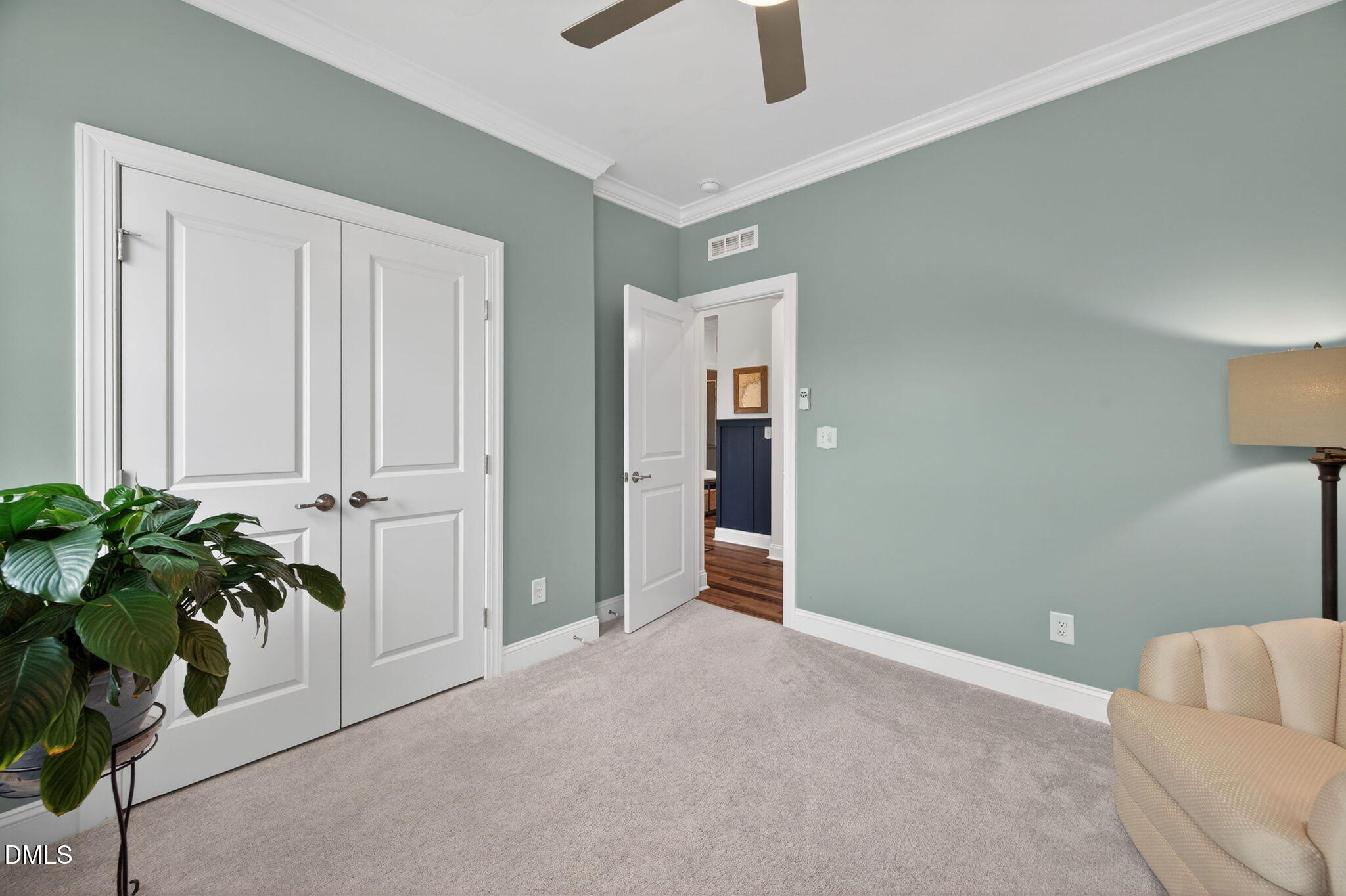 118 Mahogany Raleigh, NC 27610 - Photo 33 of 74 an empty room with potted plants and wooden floor