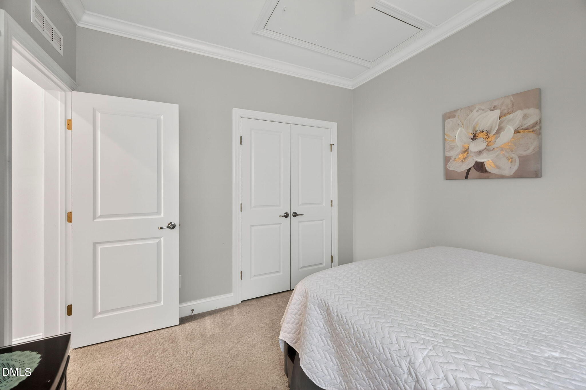 118 Mahogany Raleigh, NC 27610 - Photo 35 of 74 a bedroom with a bed and painting on the wall