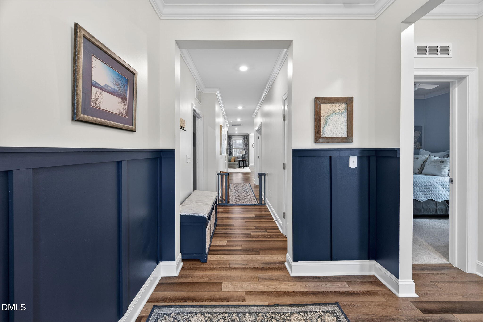 118 Mahogany Raleigh, NC 27610 - Photo 3 of 74 a view of a hallway with wooden floor and staircase