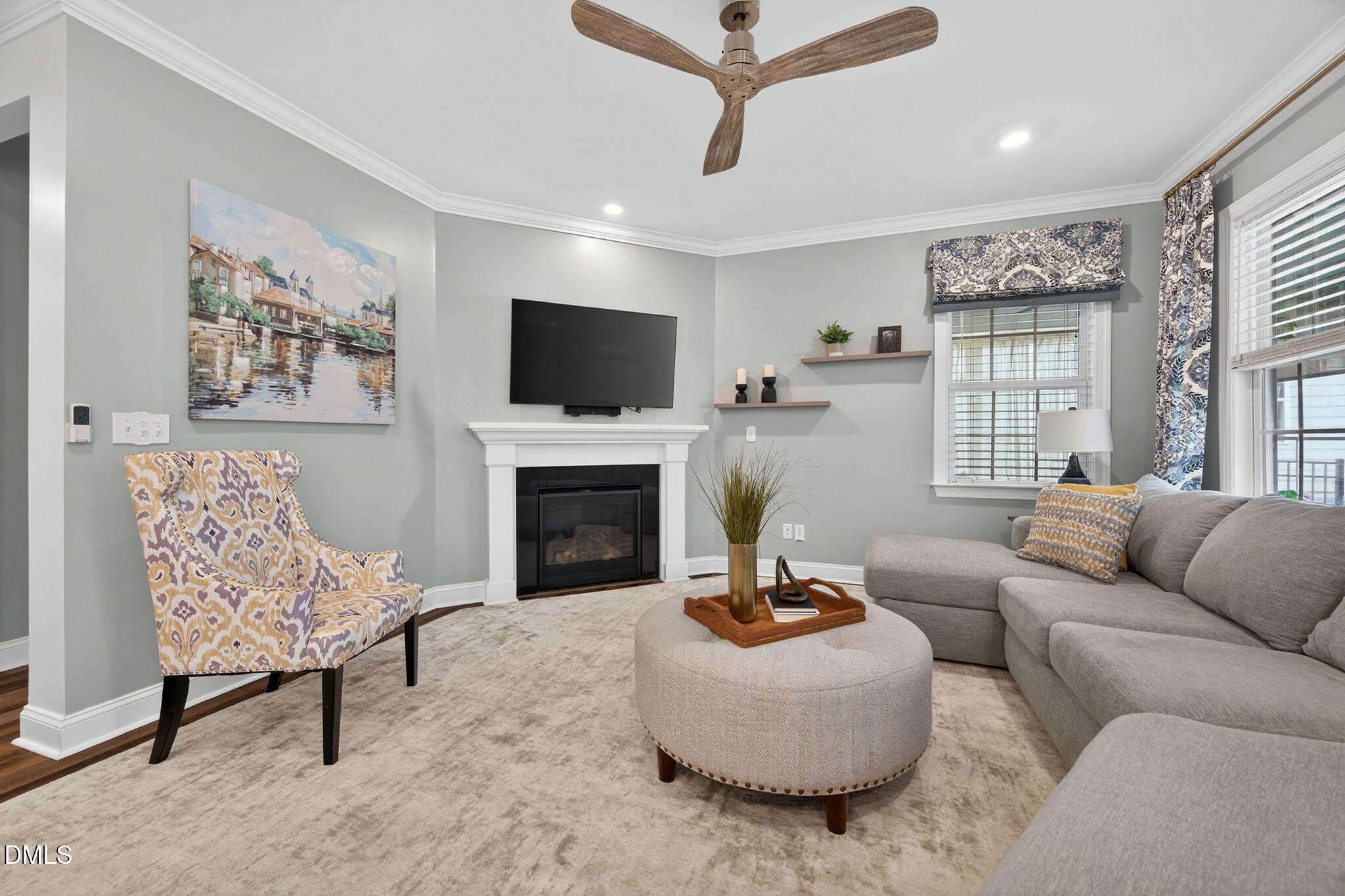 118 Mahogany Raleigh, NC 27610 - Photo 5 of 74 a living room with furniture a fireplace and a flat screen tv