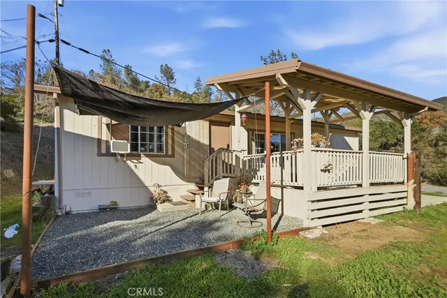 a backyard of a house with barbeque oven