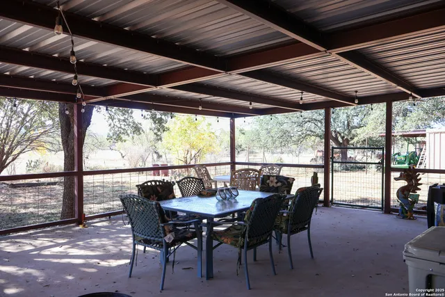 a dining room with furniture and outdoor space