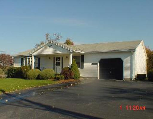 41 Upper Gore Road Webster, MA 01570 - Photo 1 of 1 a front view of a house with a garden