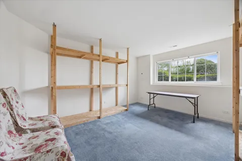 a bedroom with bed and a window
