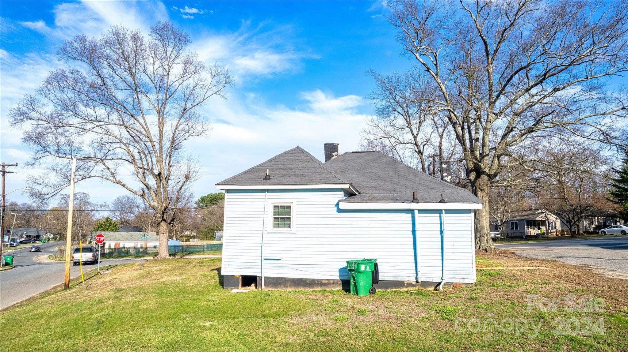 802 South Hoskins Road Charlotte, NC 28208 - Photo 15 of 15 a front view of a house with a yard and garage