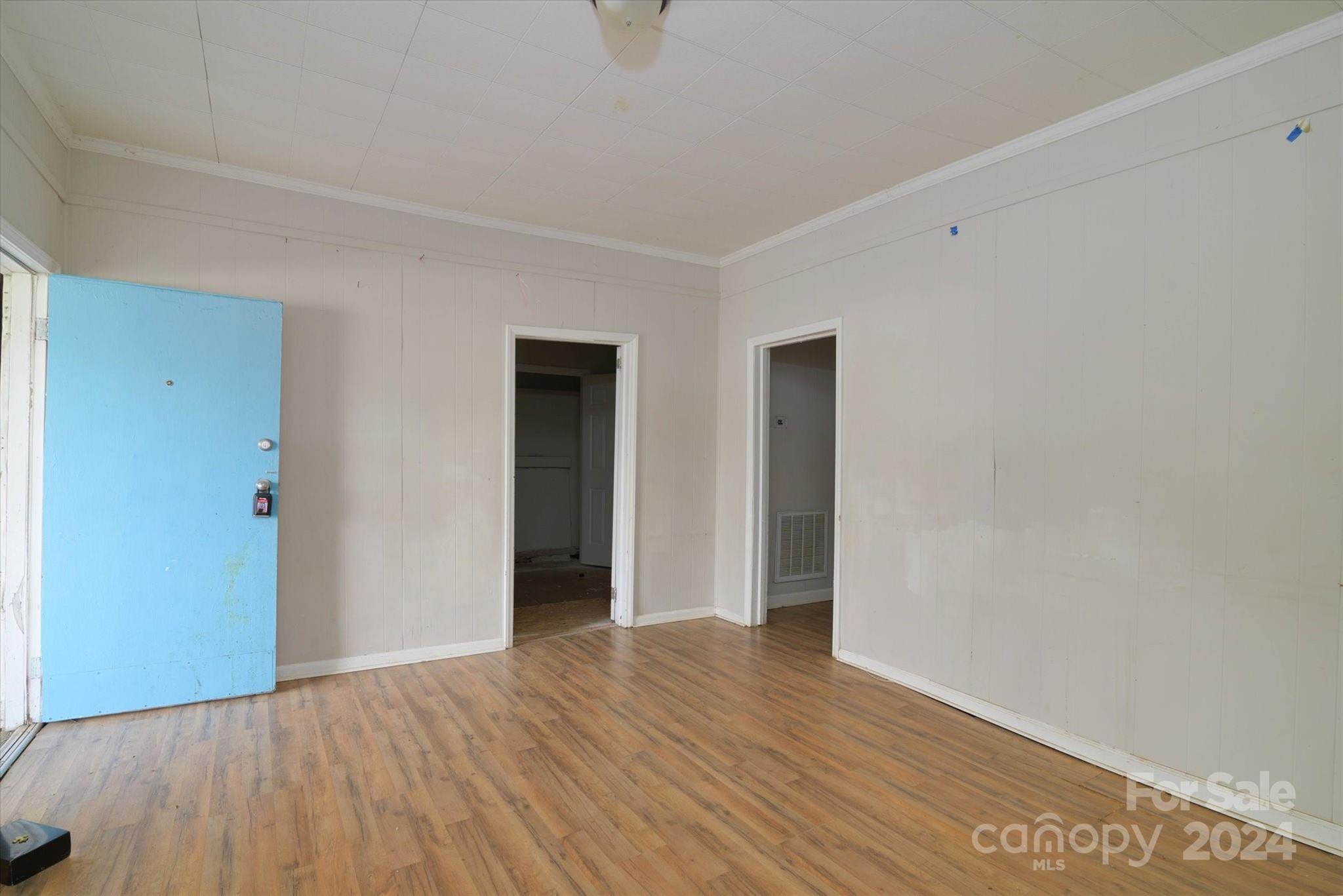 802 South Hoskins Road Charlotte, NC 28208 - Photo 7 of 15 a view of an empty room with wooden floor
