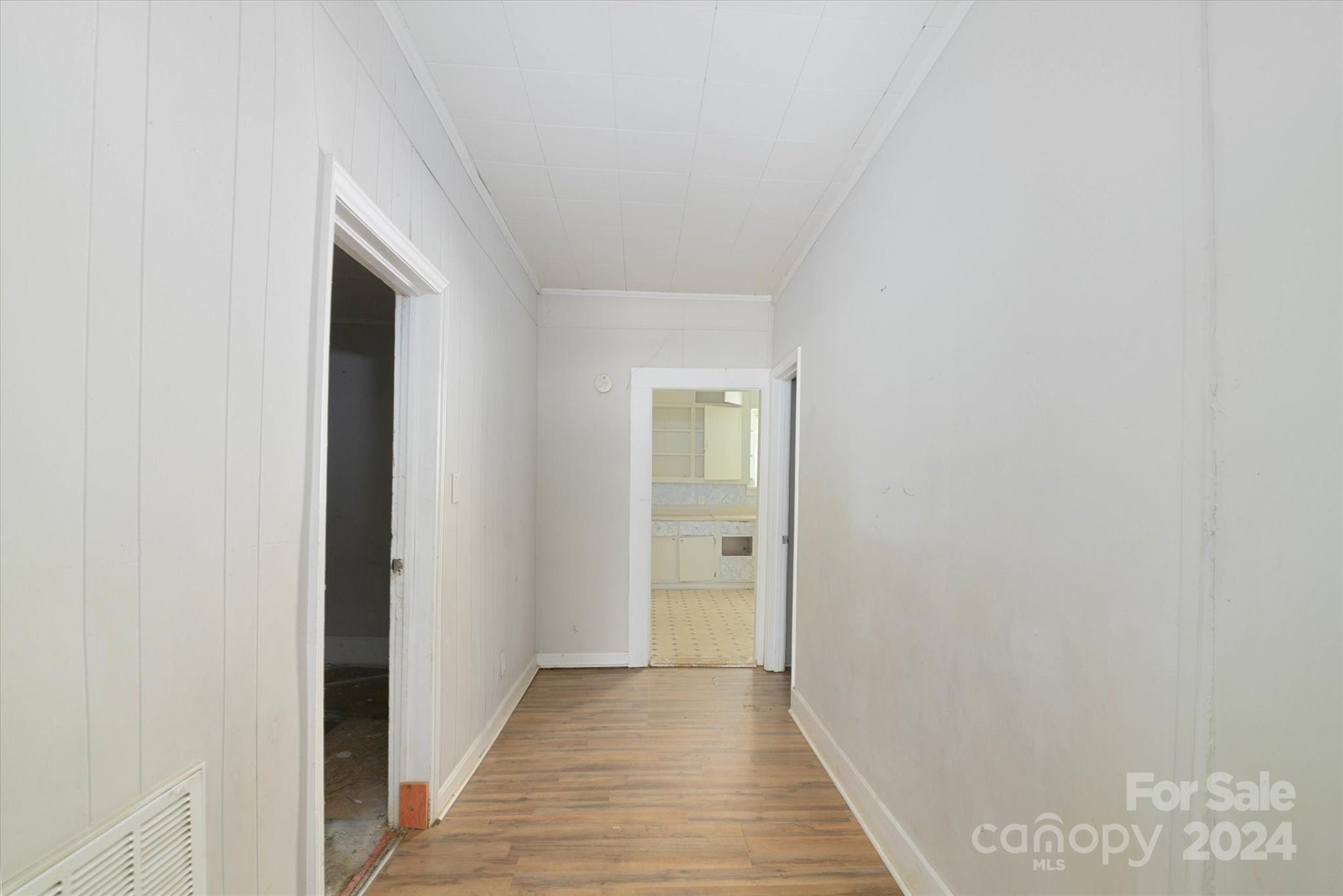 802 South Hoskins Road Charlotte, NC 28208 - Photo 9 of 15 a view of a hallway with wooden floor