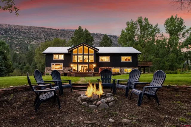 a view of a chairs in a backyard
