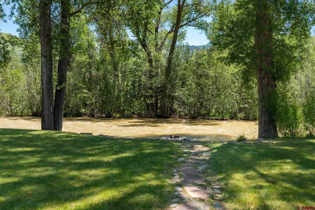 a view of swimming pool with a yard