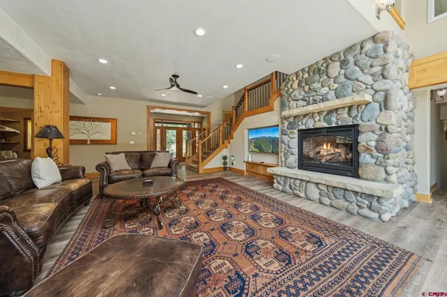 a living room with furniture and a fireplace