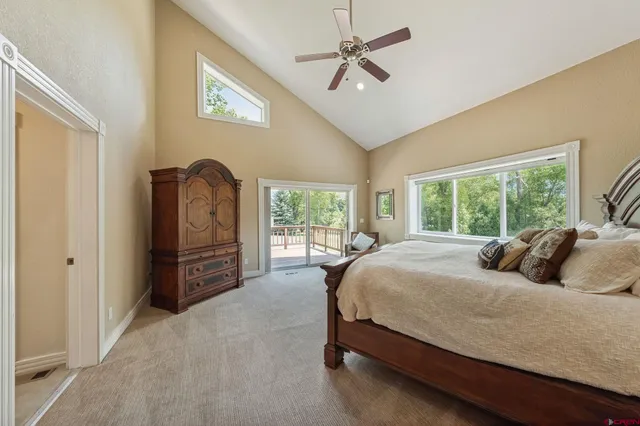 a bedroom with a large bed and a window