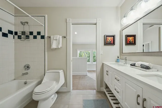 a spacious bathroom with a sink a toilet and shower