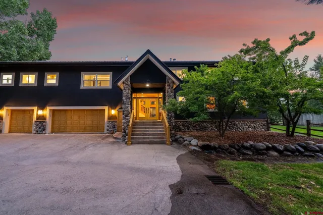 a backyard of a house with yard and outdoor seating