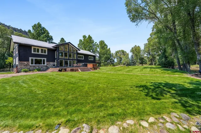 a view of a house with a big yard