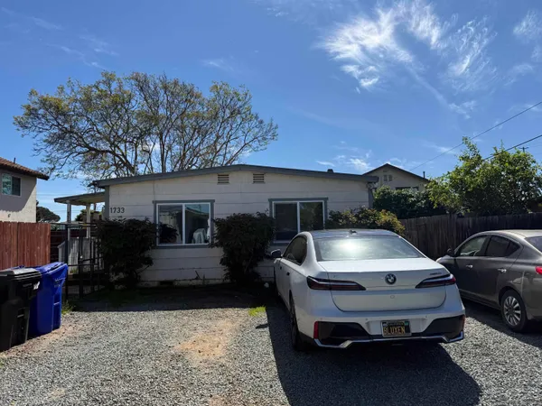a car parked in front of a house