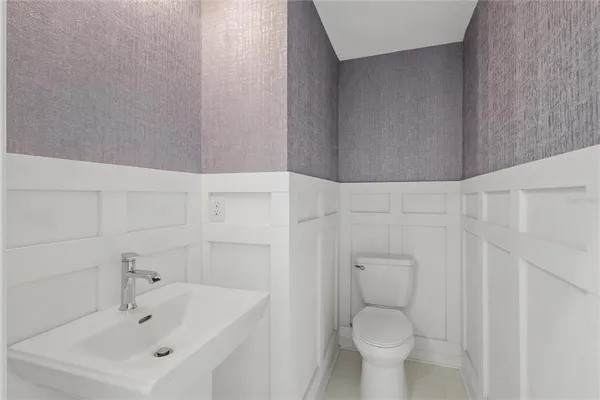 a bathroom with a toilet and a sink