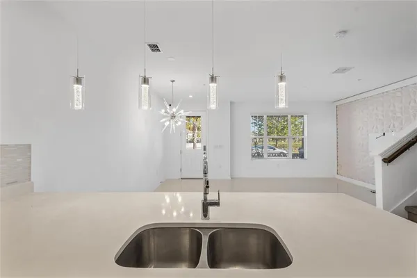 a bathroom with a sink and a window