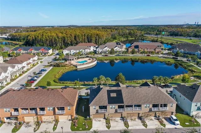 an aerial view of residential houses with outdoor space