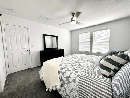 a bathroom with a double vanity sink and mirror