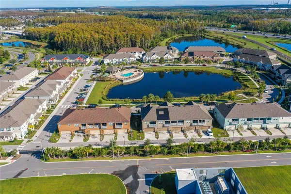 an aerial view of residential houses with outdoor space