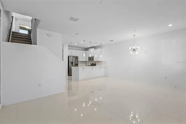a view of a kitchen with a sink and cabinets