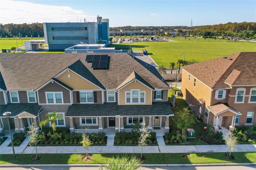 10251 Highline Crest Street Orlando, FL 32832 - Photo 5 of 35 a aerial view of a house with a garden and a lake view
