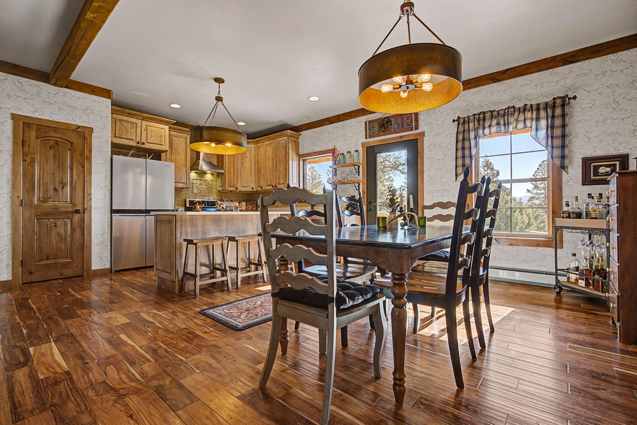 213 Big Canyon Point Ridgway, CO 81432 - Photo 9 of 41 a view of a dining room with furniture and wooden floor