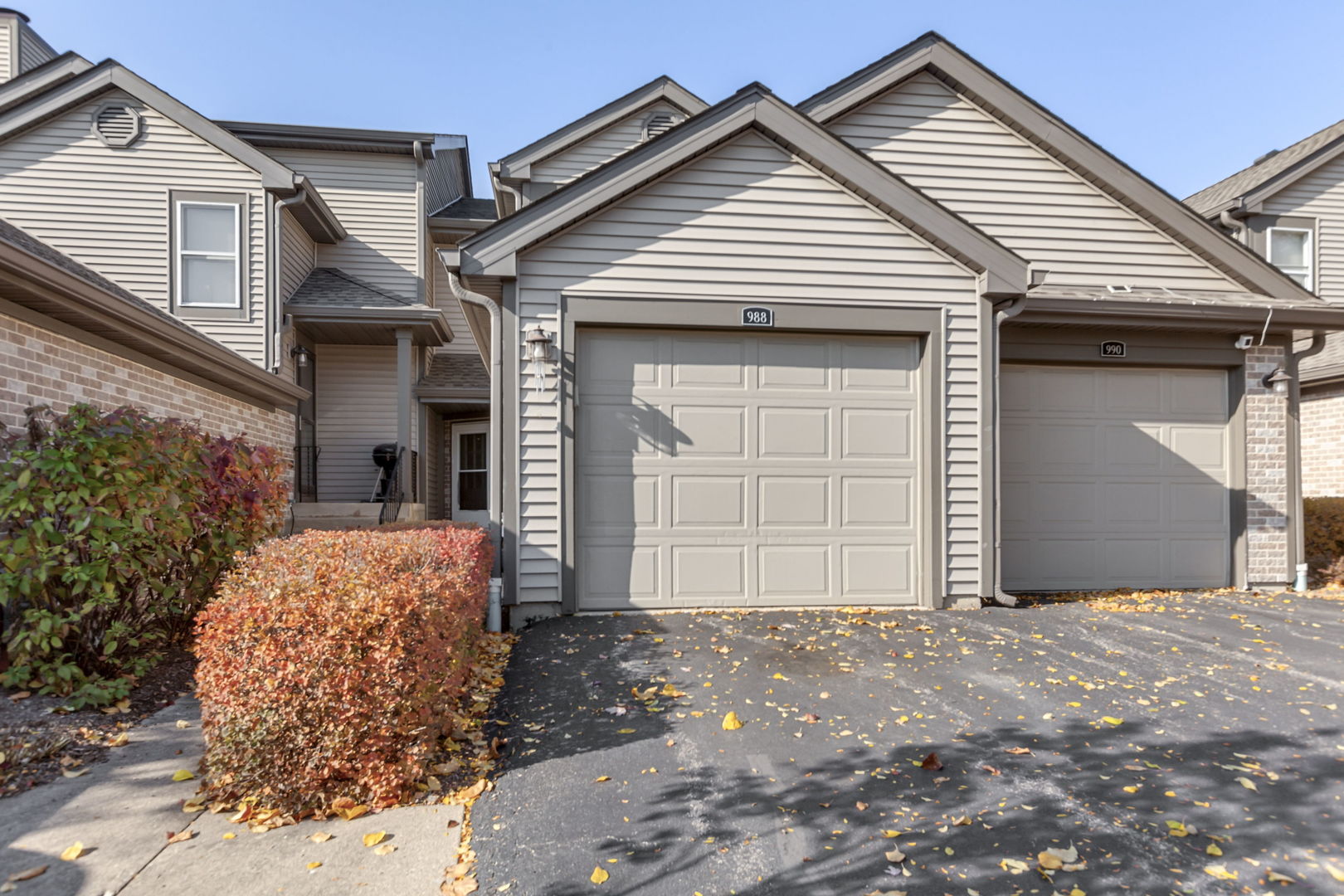 988 Butter Creek Court, Unit 4 Hoffman Estates, IL 60169 - Photo 1 of 1 a front view of a house with a outdoor space
