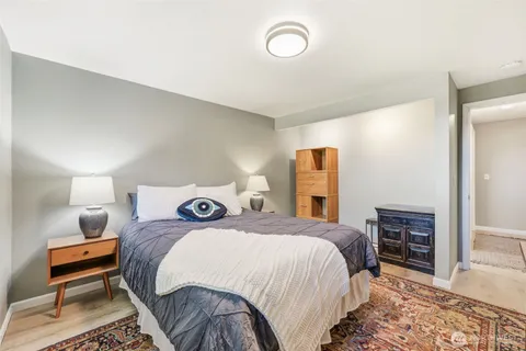 a bedroom with a bed and a dresser in it