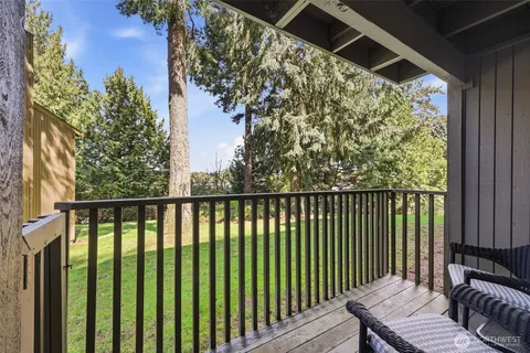 a view of a balcony with wooden floor