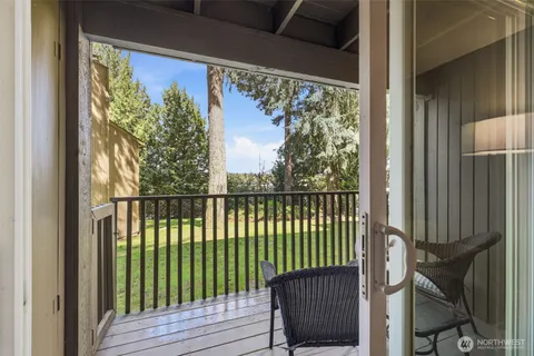a view of a big house with a yard