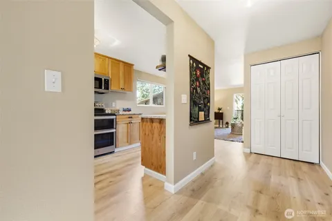 a view of a kitchen with wooden floor