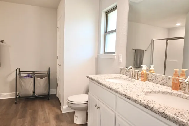 a bathroom with a glass shower door
