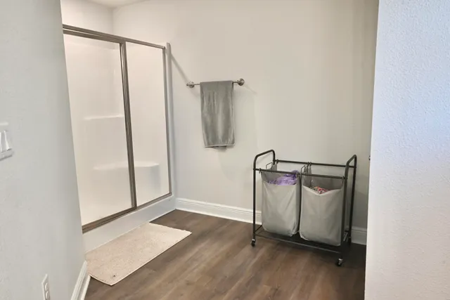 a bedroom with a dresser and a dresser