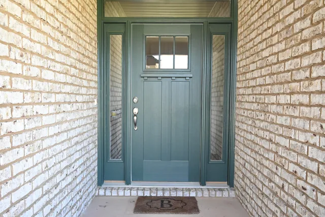 a room with wooden floor and a window