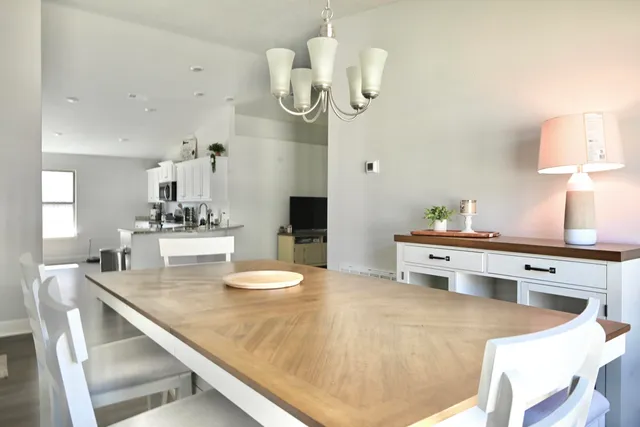 a kitchen with a sink cabinets and wooden floor