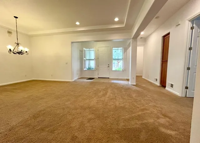 a kitchen with granite countertop a stove top oven microwave and cabinets