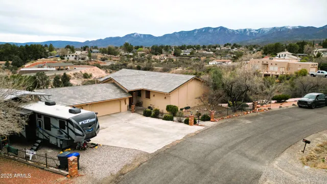 an aerial view of a house with a garden